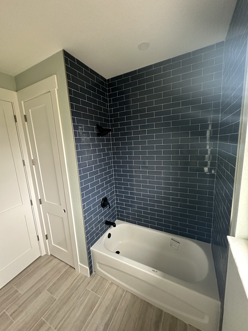 Wood look floor tile with decorative mosaic border