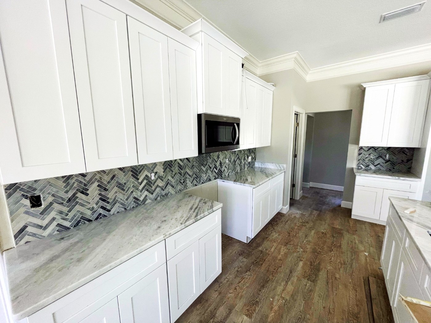 Natural stone herringbone marble backsplash