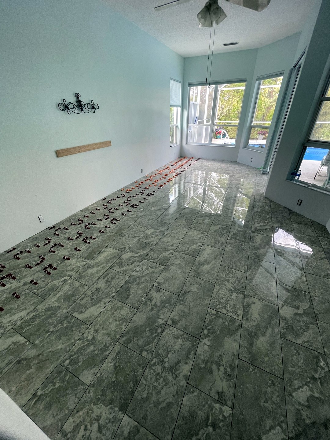 Grey marble-look rectangular floor tile installation