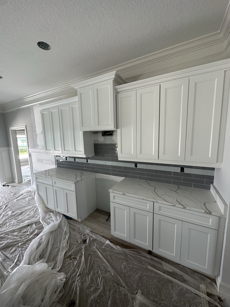Blue herringbone tile shower installation
